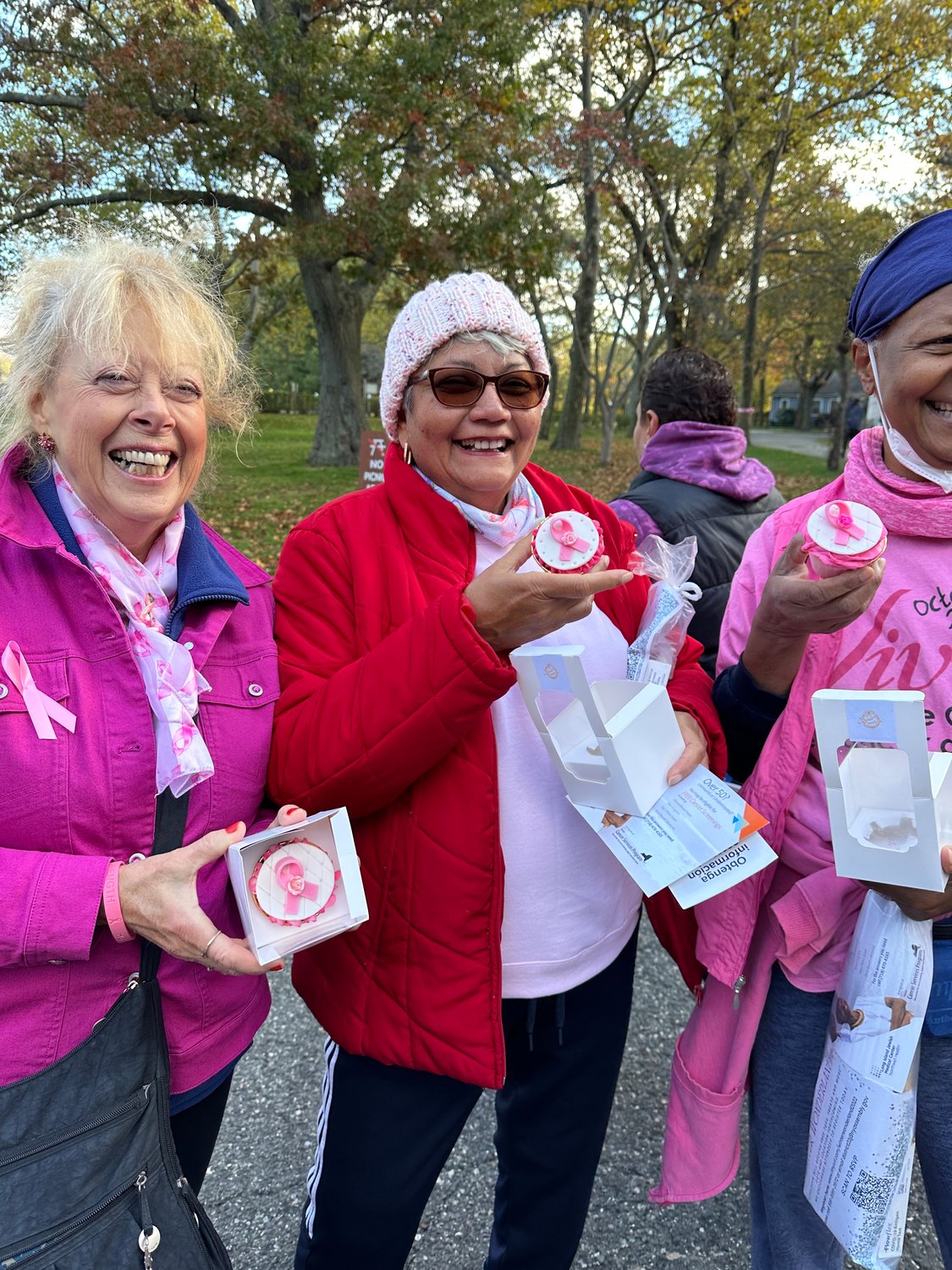 Attendees were all smiles with their custom breast cancer awareness- themed cupcakes.